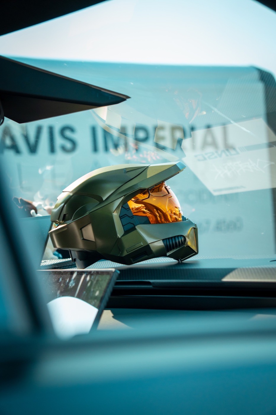 Close-up detail photograph of a helmet resting on a dashboard